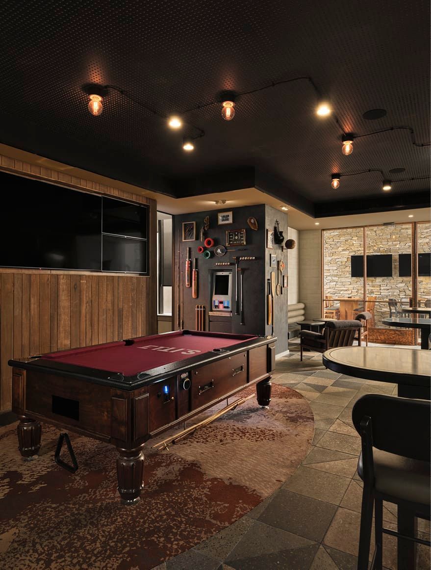 FIT WITH MEMROBILIA AND TIMBER PANNELING, PROVIDES A MOODY SPACE FOR SPORTS WATCHING