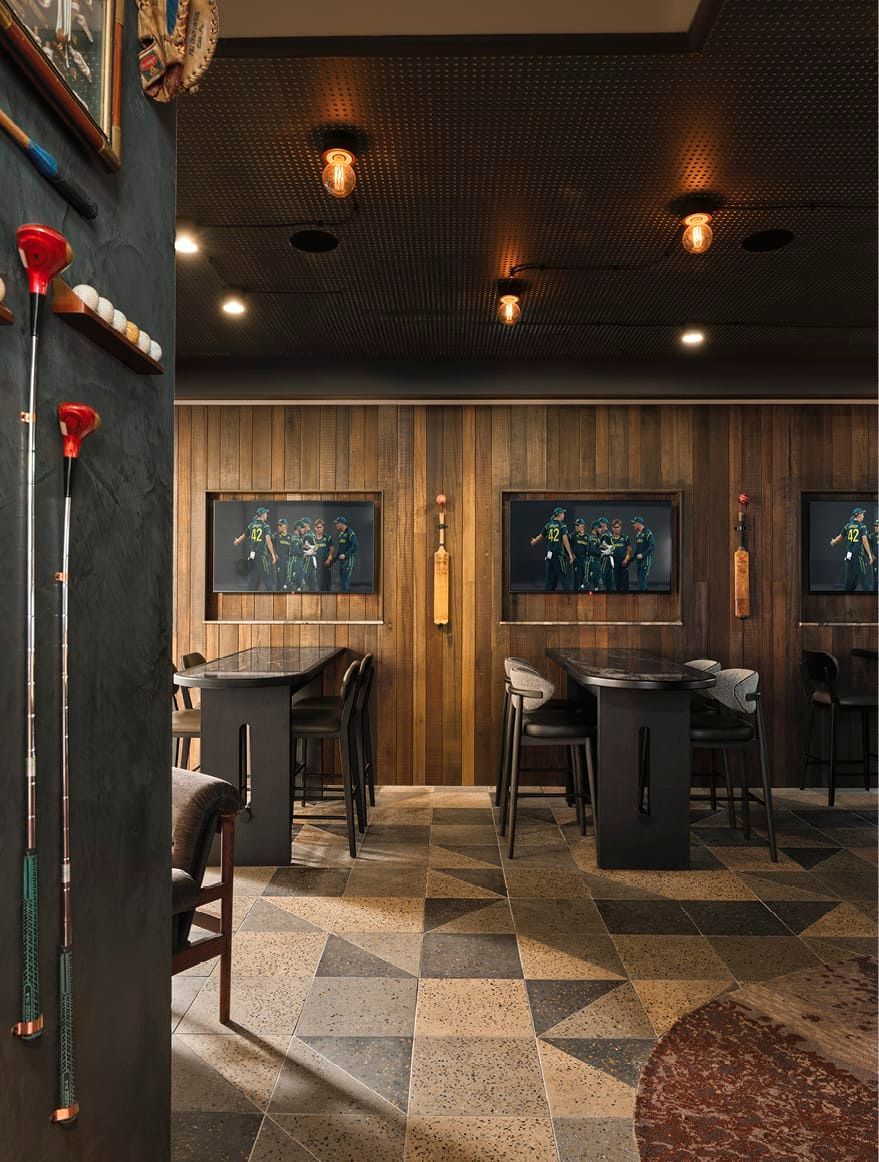 FIT WITH MEMROBILIA AND TIMBER PANNELING, PROVIDES A MOODY SPACE FOR SPORTS WATCHING