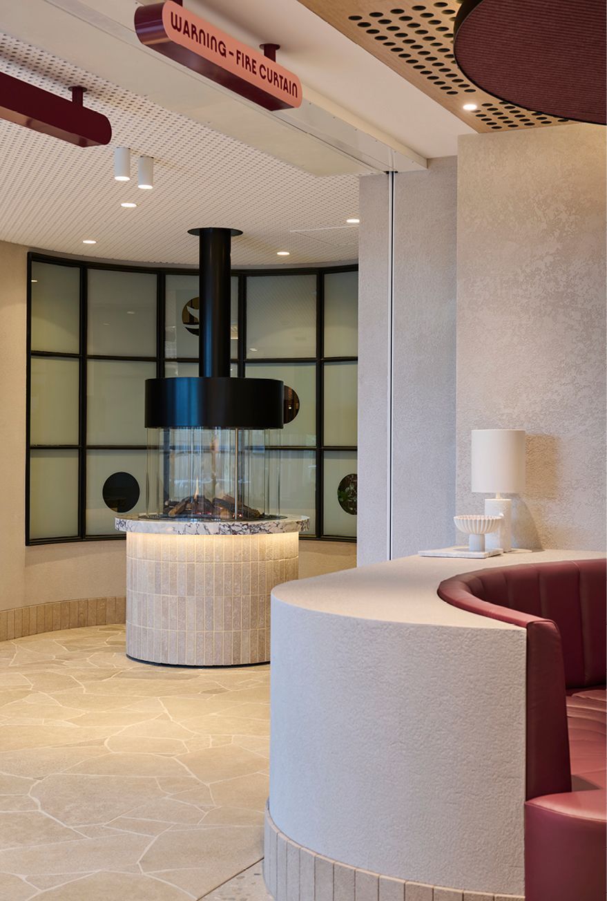 Crafted details include oversized signage, copper downpipe and furnished waiting space