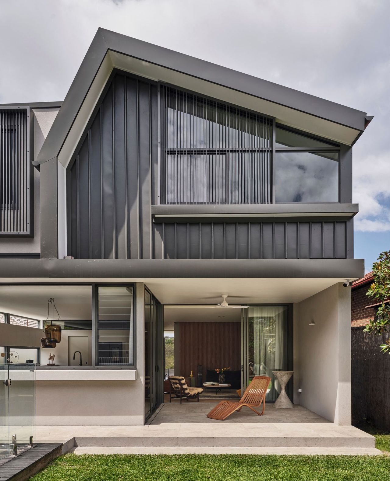 Large open-plan living and dining space spills out to the pool at the rear